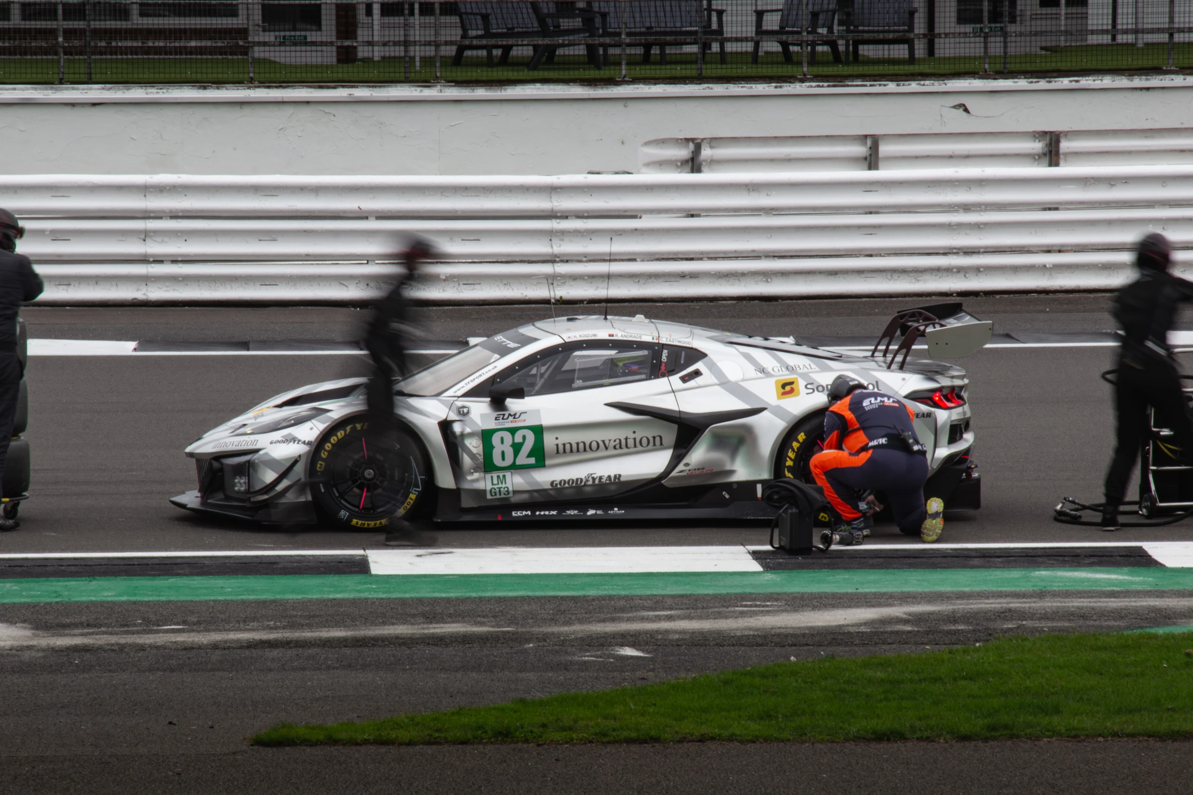 Crew working on the number 82 Corvette in the Silverstone pit lane