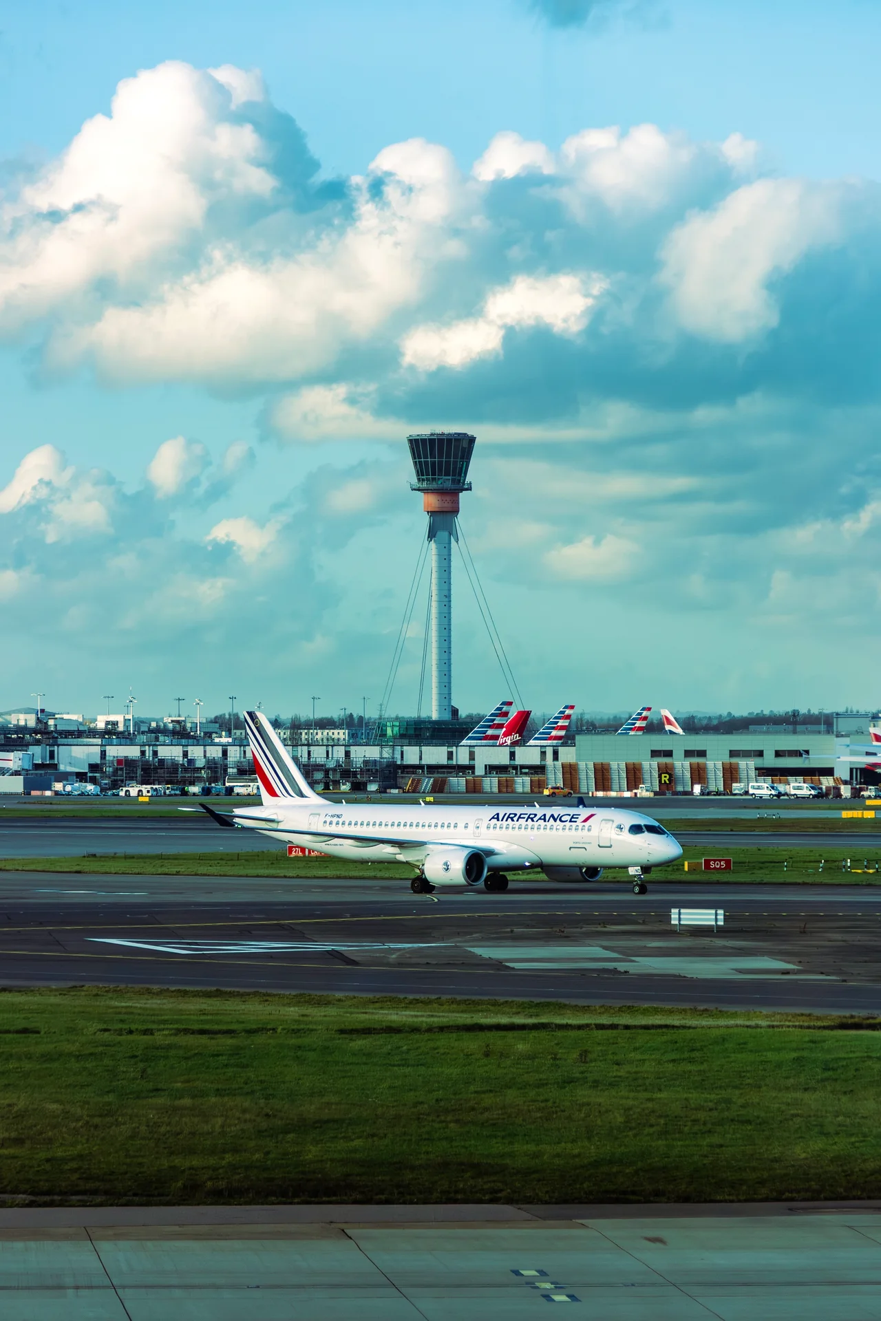 Aircraft beneath the control tower