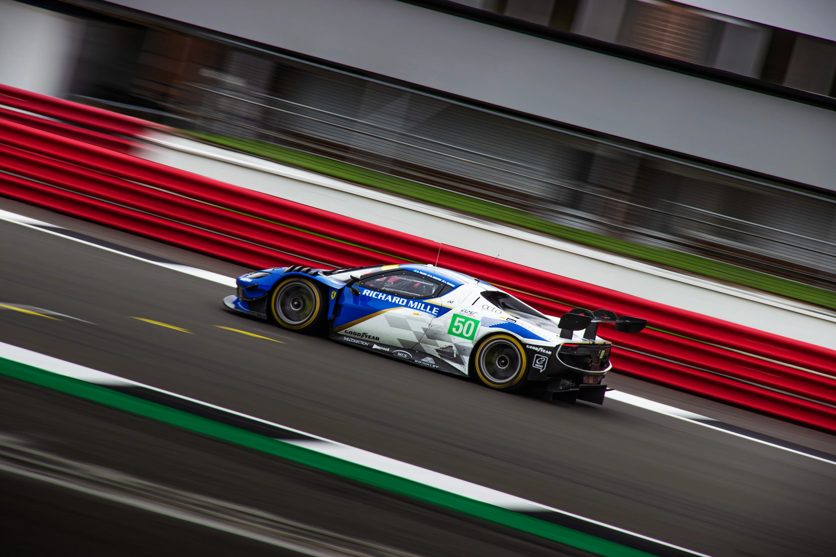 GT racing car taking a corner on track